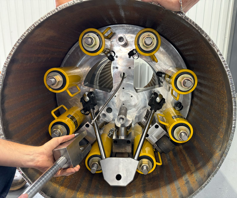 Close-up of the rolling double block-and-bleed tool positioned inside an INVAR pipe during testing